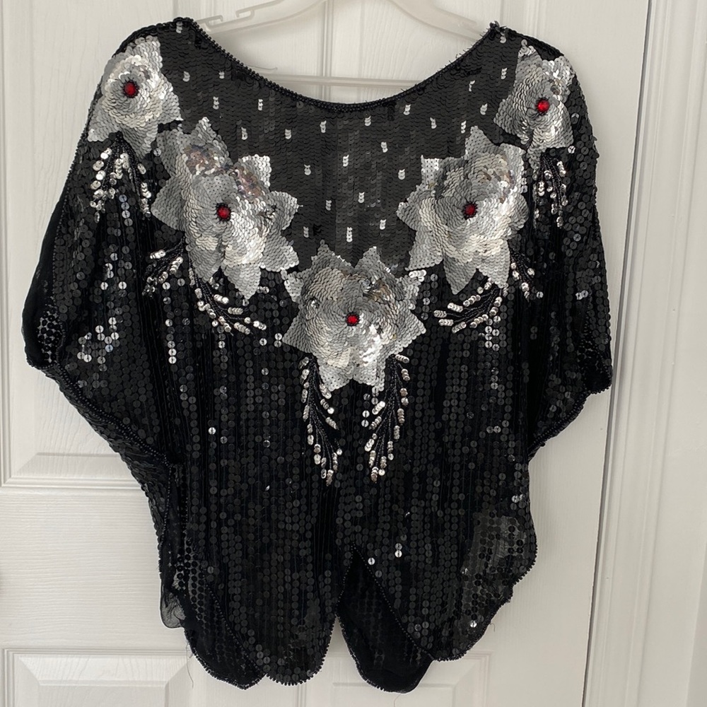 Black sequin top, with grey and red flower in sequin (with padded shoulders)